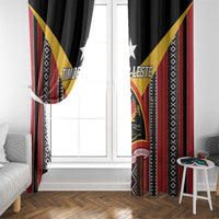 Hanging black window curtains with red and yellow diagonal accents and tribal stripe borders