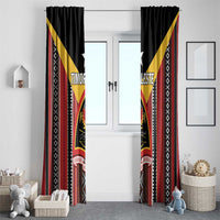 Paired black window curtain panels with red vertical stripes and yellow geometric diamond trim