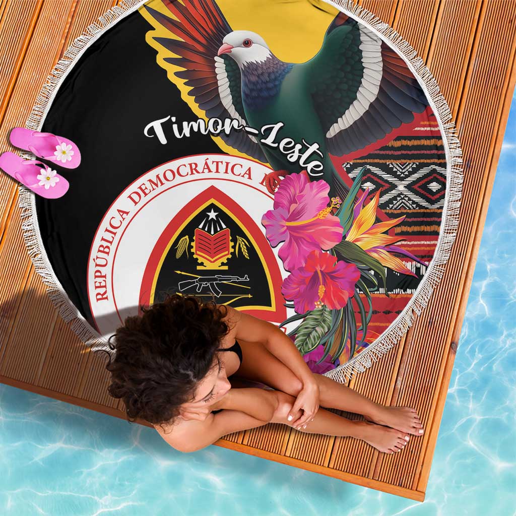 Black round beach blanket with white fringe border and national crest, floral accents