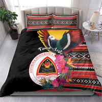 Black duvet cover and matching pillows with colorful pigeon, hibiscus flowers, striped trim
