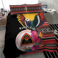 Black duvet cover with pigeon and floral emblem, geometric striped border on pillows