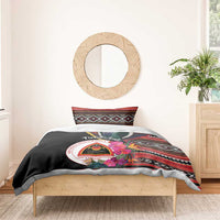 Black duvet cover with crest and colorful flowers, pigeon graphic, striped pillow