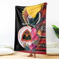 Black blanket draped over furniture with dove, hibiscus blooms, and decorative patterns