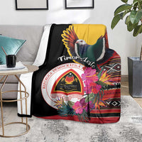 Black blanket with dove and Timor-Leste emblem, hibiscus flowers, and striped patterns