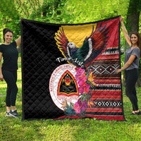 Black quilt featuring a flying bird, red-yellow wings, patterned stripe border and crest