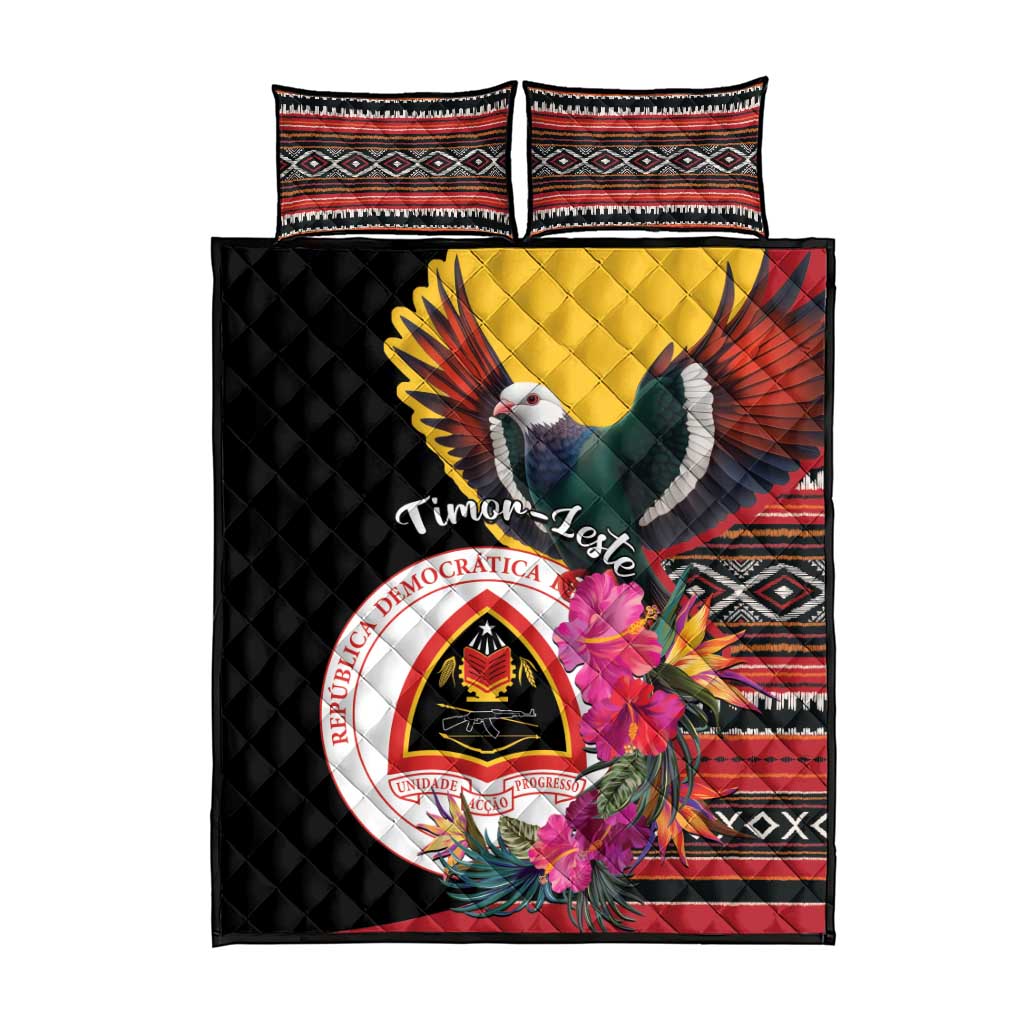 Black quilt bed set with central crest, pigeon and hibiscus, plus two patterned shams