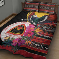 Black quilt bed set with pigeon and floral print over red and geometric border, two shams