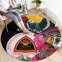 Black round carpet featuring bird, hibiscus, and “Timor-Leste” text with crest
