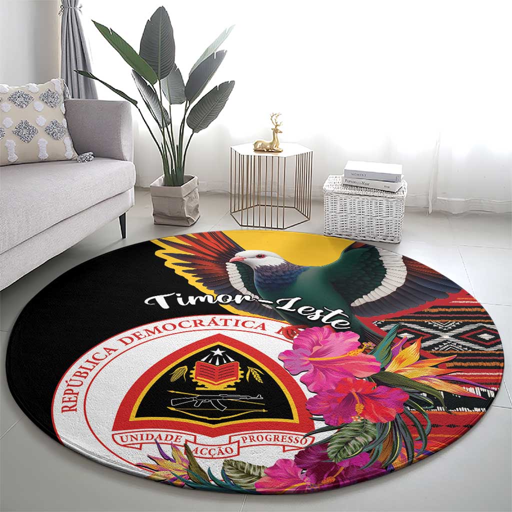 Black round carpet with bird and hibiscus flowers, “Timor-Leste” banner and crest