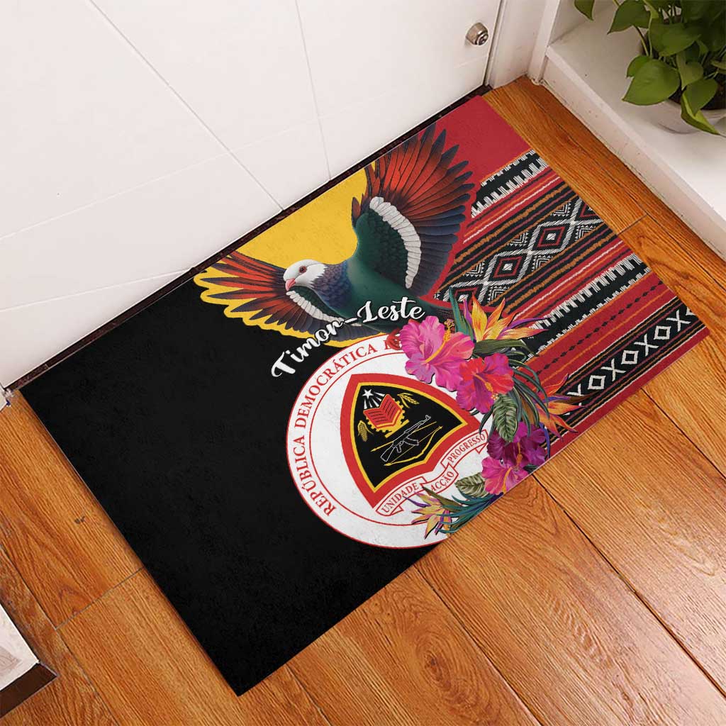 Black rubber doormat with pigeon, hibiscus flowers, crest emblem and striped border pattern