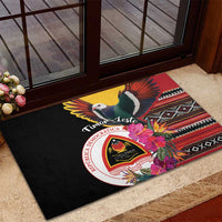 Black rubber doormat with pigeon wings, hibiscus flowers, crest emblem and multicolor striping