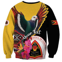 Unisex sweatshirt with pigeon, flowers, and crest graphic, yellow body with black sleeves