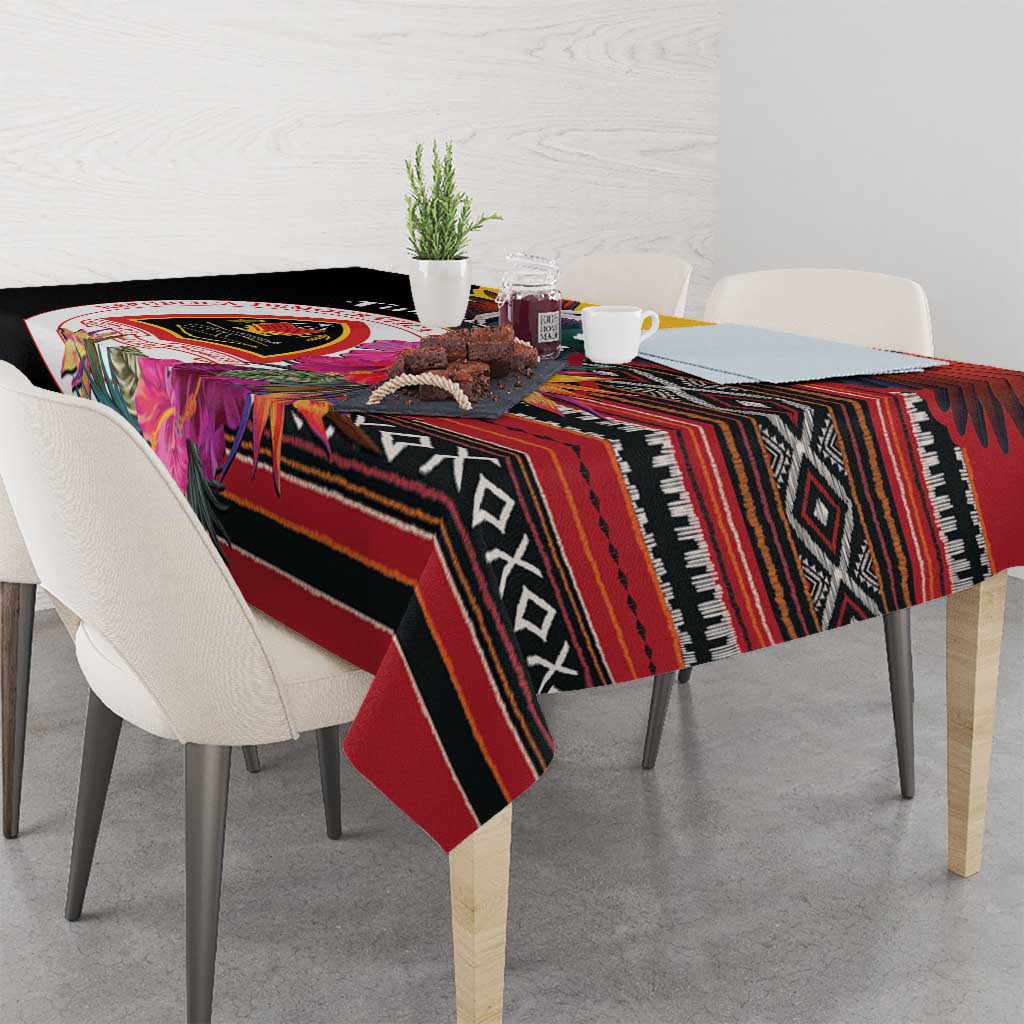 Black tablecloth draped on table with bold red, orange, and tribal geometric bands