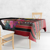 Black tablecloth with side drape, showing tropical bird and floral details over stripes