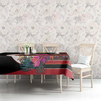 Black tablecloth on dining set with hibiscus and vivid multicolor geometric stripes
