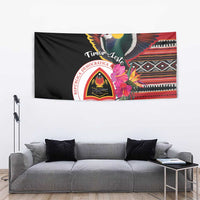 Black Timor-Leste tapestry showing imperial pigeon, hibiscus flowers, and stylized textile bands
