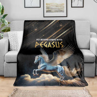 Black Pegasus blanket with winged horse and clouds, spread over gray sofa