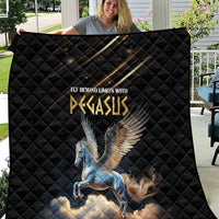 Black quilt with blue Pegasus graphic, shown spread out outdoors on chair back
