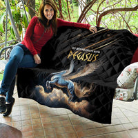 Black Pegasus quilt with blue winged horse graphic, draped over a couch