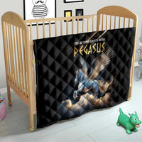 Black quilt with diamond quilting and blue Pegasus graphic, laid on a bed