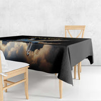 Black Pegasus tablecloth with cloud-like print draped over bench seating