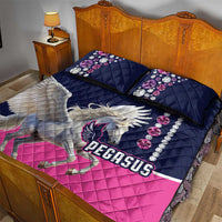 Pegasus quilt bed set with two pillows, navy and pink quilt, Pegasus logo on cover.