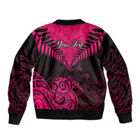 Pink and black patterned bomber jacket with ribbed collar, cuffs, and bold back design