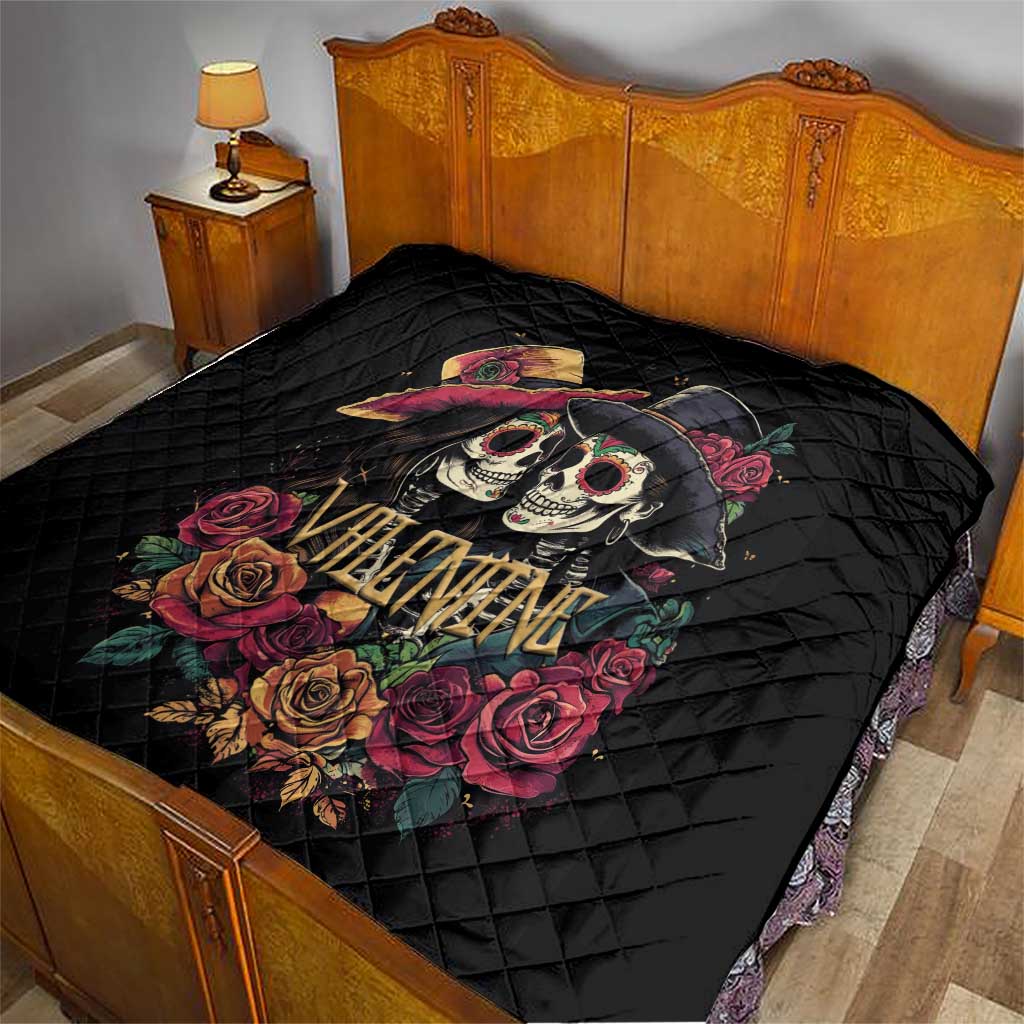 Black quilt on bed with couple skull and rose artwork and “Valentine” text