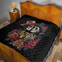 Black quilt on bed with couple skull and rose artwork and “Valentine” text