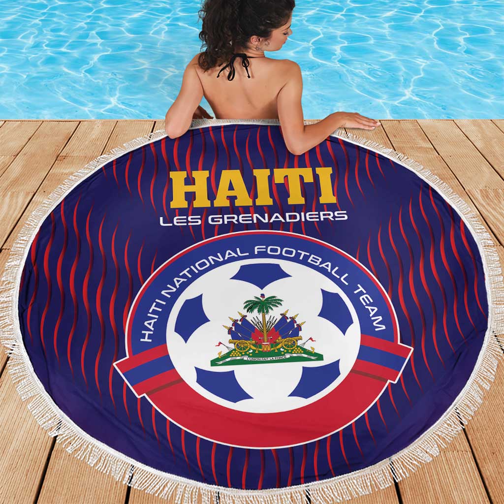 Round blue beach blanket with red vertical stripes, Haiti crest, and white fringed border.