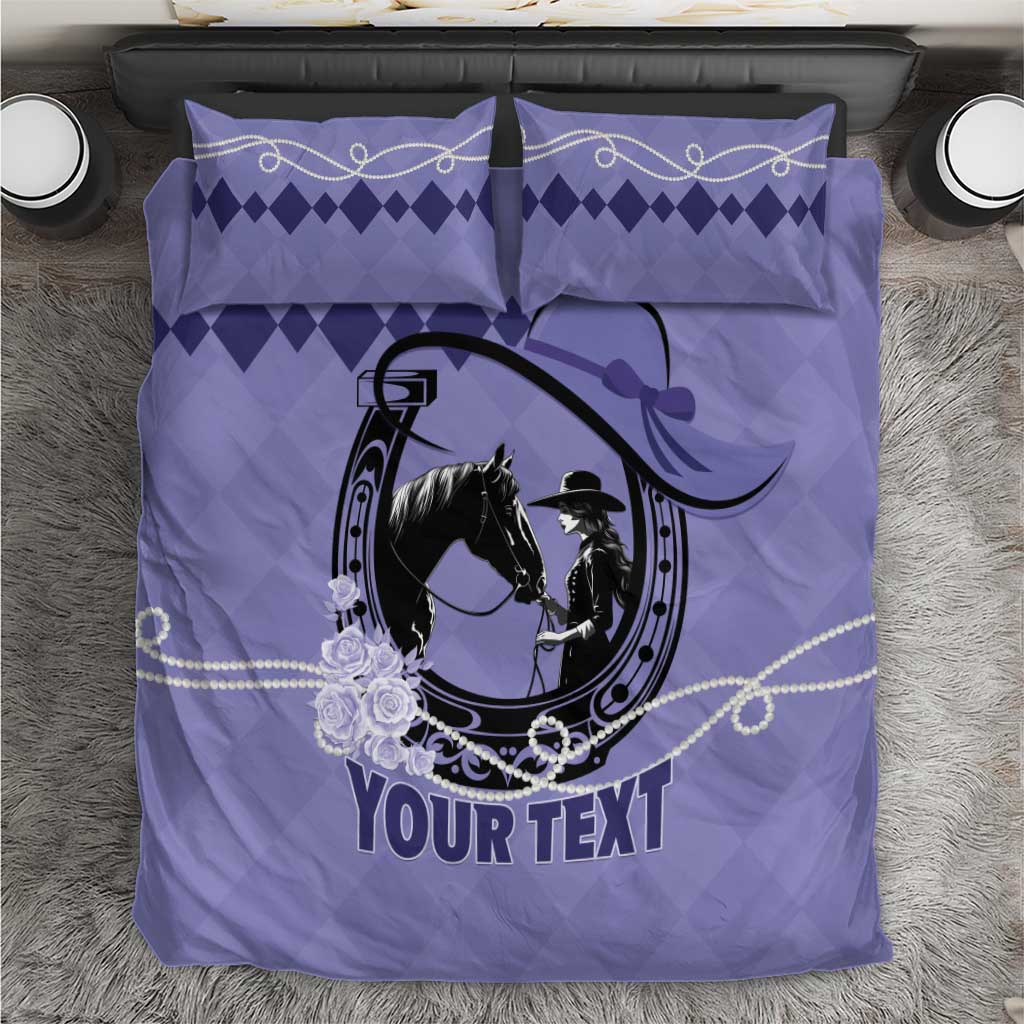 Purple duvet set with horse-and-rider oval emblem, floral accents, and two matching pillowcases