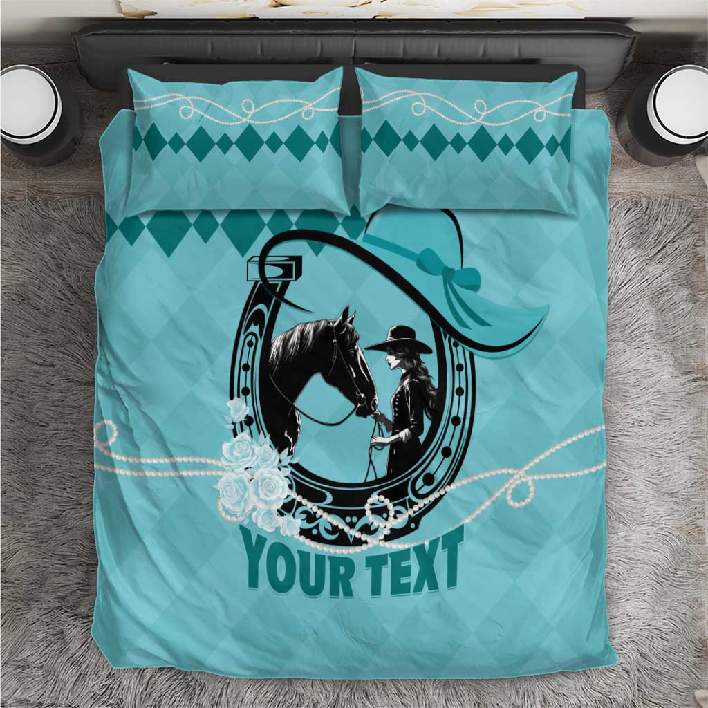 Teal duvet cover featuring horse-and-rider emblem with diamond pattern and two pillows