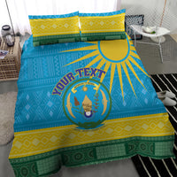 Blue Rwanda bedding set with coat of arms logo and African geometric stripes, with two pillows