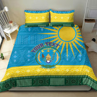 Blue Rwanda bedding set featuring coat of arms and African pattern border, styled with pillows