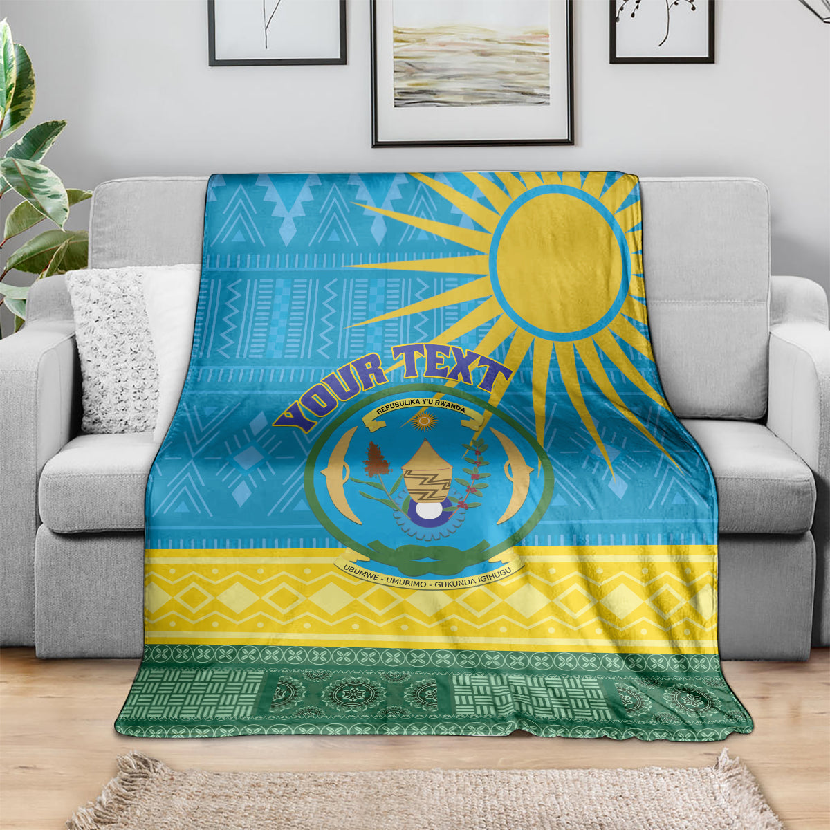 Rwanda blanket throw with blue top, yellow mid zigzags, green bottom and crest inside emblem