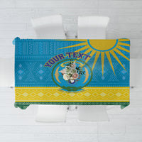 Personalized tablecloth showing “YOUR TEXT” and Rwanda-style coat of arms, blue and yellow