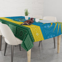 Personalized tablecloth with green, blue, and yellow African-inspired pattern on dining table