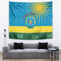 Blue Rwanda tapestry wall hanging with sunburst, circular coat of arms, yellow and green bands