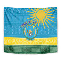 Close-up blue Rwanda tapestry with sunburst, circular coat of arms, yellow stripe and green base