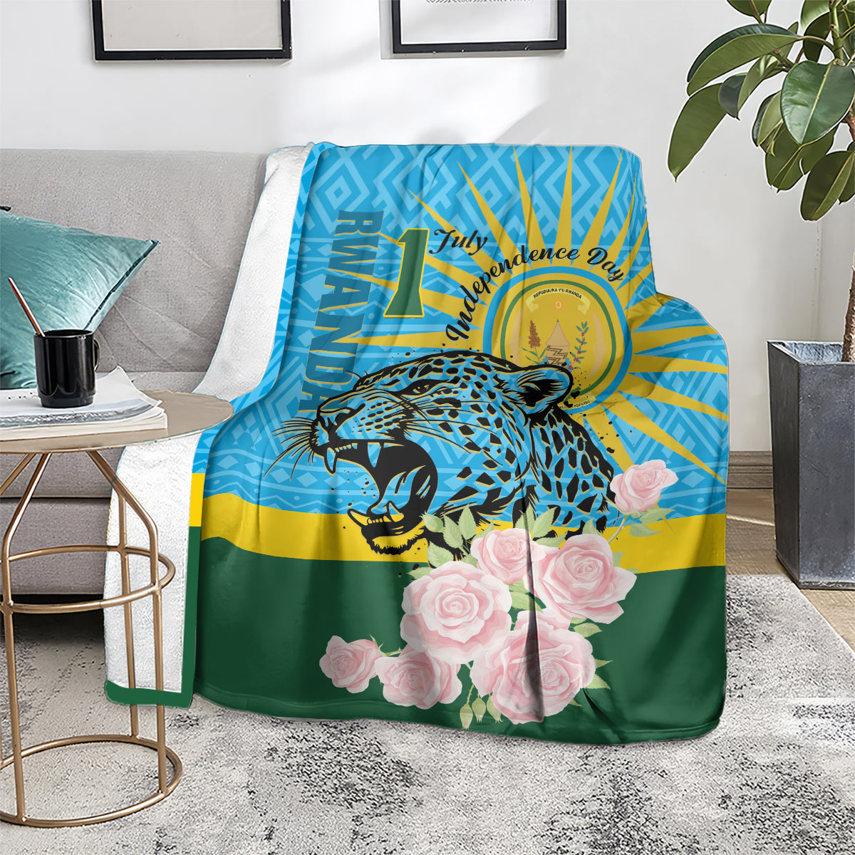 Leopard and rose graphic blanket with blue sunburst and green bottom, laid on floor