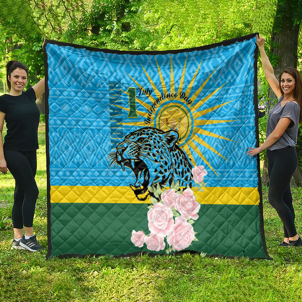 Blue quilt spread outdoors: leopard graphic, sunrays, pink roses, green-yellow stripe.