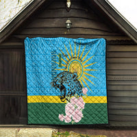 Blue quilt hanging on wooden doorway: leopard, sunrays, pink roses, green-yellow stripes.