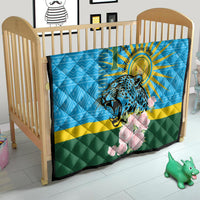 Blue quilt in baby crib with leopard, sunrays, pink roses, and green-yellow stripes.