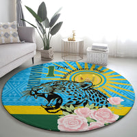 Blue round carpet featuring a leopard and pink roses with yellow sunburst