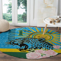 Blue round carpet with leopard and pink rose flowers, dark green border