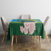 Rectangular tablecloth on dining table: green field with pink rose flowers