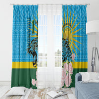 Blue window curtain set with leopard and roses, hung above a sheer inner curtain.