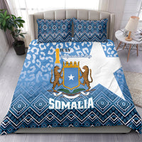Blue and white Somalia bedding set with shield emblem, leopards, and diamond border pattern