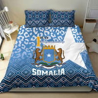 Blue and white bedding set with Somalia shield emblem, leopard artwork, and patterned border