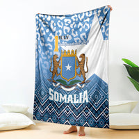 Blue and white Somalia blanket with leopard emblem, diamond border, and July Independence Day